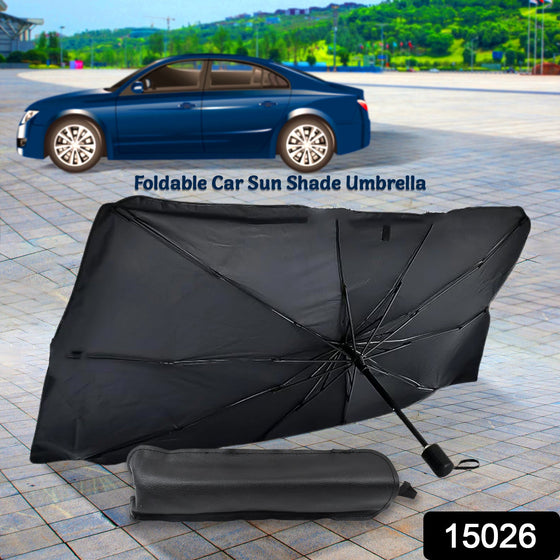 A black foldable car sunshade umbrella is displayed open with its storage pouch on a paved surface, a blue car in the