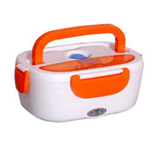 Electric lunch box opened, showing rice and vegetable sections