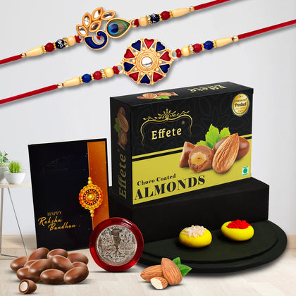 Rakhi Gift Combo for brother featuring two premium rakhis, choco almonds, silver coin, and roli chawal.