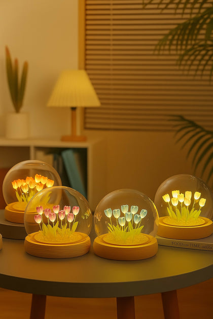 A finished DIY Flower Dome Lamp glowing with soft LED light, featuring delicate artificial flowers.