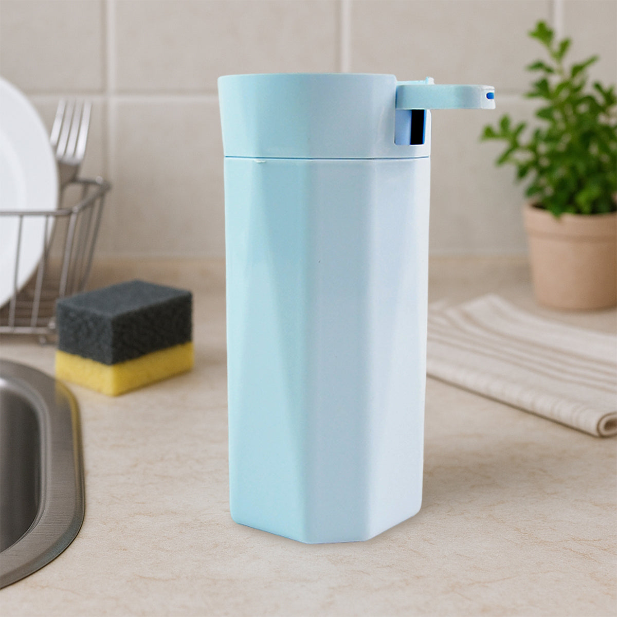 Apex Push It! dish soap dispenser next to a kitchen sink