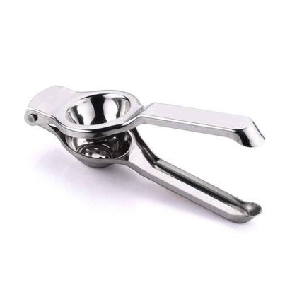 Lemon squeezer with half lemon ready for juicing