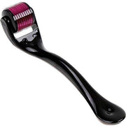 A black handled derma roller with a magenta micro-needle head is angled on a clean white surface.