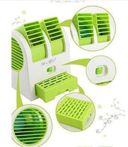 201 Dual Bladeless Mini Air Conditioner with user's hand, showing compact size