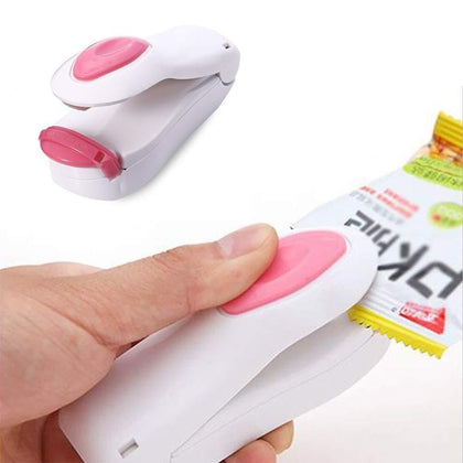 Mini handheld heat sealer in action, sealing a snack bag