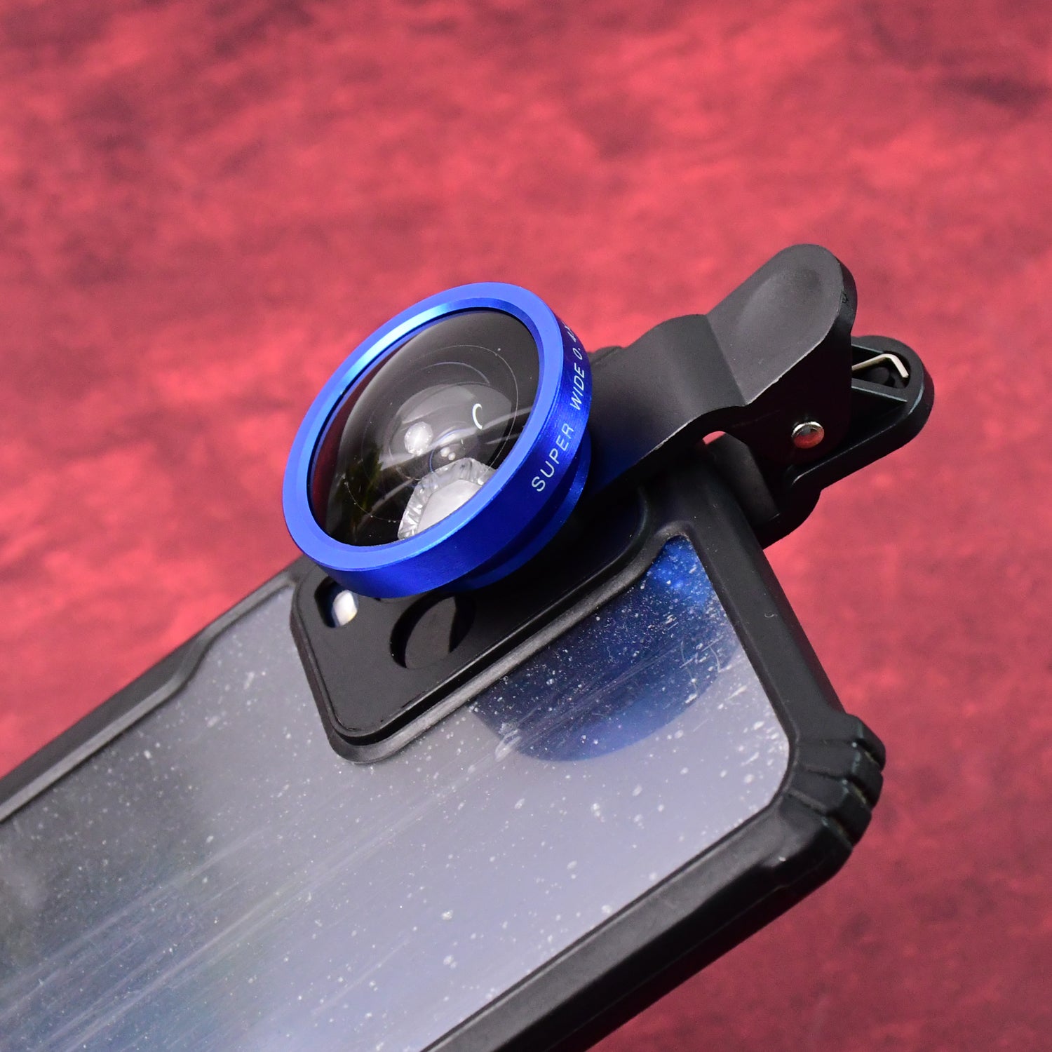 Universal clip-on wide-angle lens in its protective pouch, ready for portability