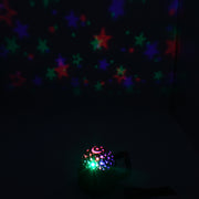 Disco ball light illuminating a party room with vibrant colors