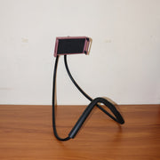 Flexible phone holder folded compactly for travel and storage