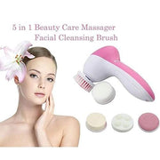 5-in-1 facial massager in pink with all five head accessories