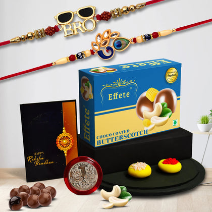 A Premium Rakhi Gift Combo featuring an elegant Peacock Rakhi, chocolate, tilak set, and greeting card.