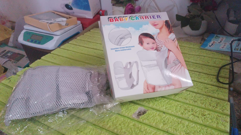 Back view of ergonomic baby carrier showing shoulder straps