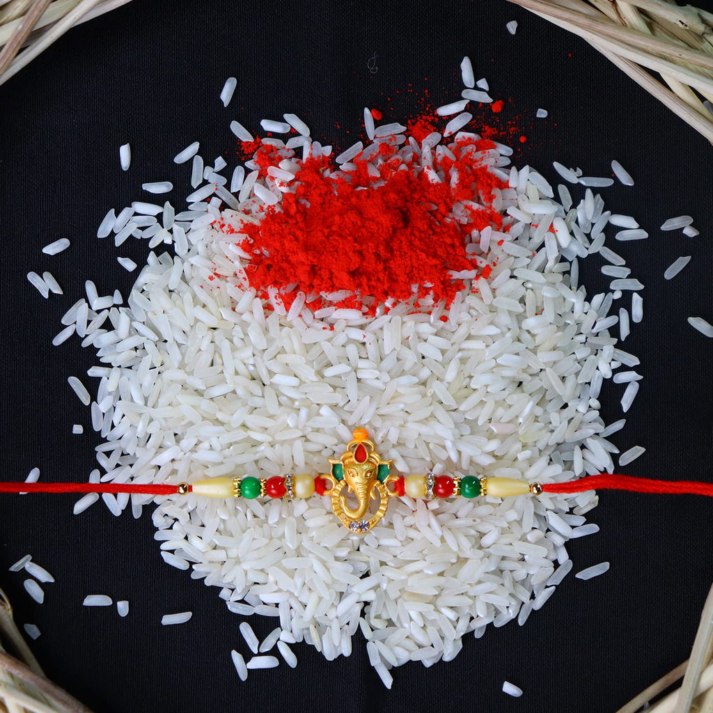 Traditional Tilak set with Roli and Chawal for the Rakhi ceremony.