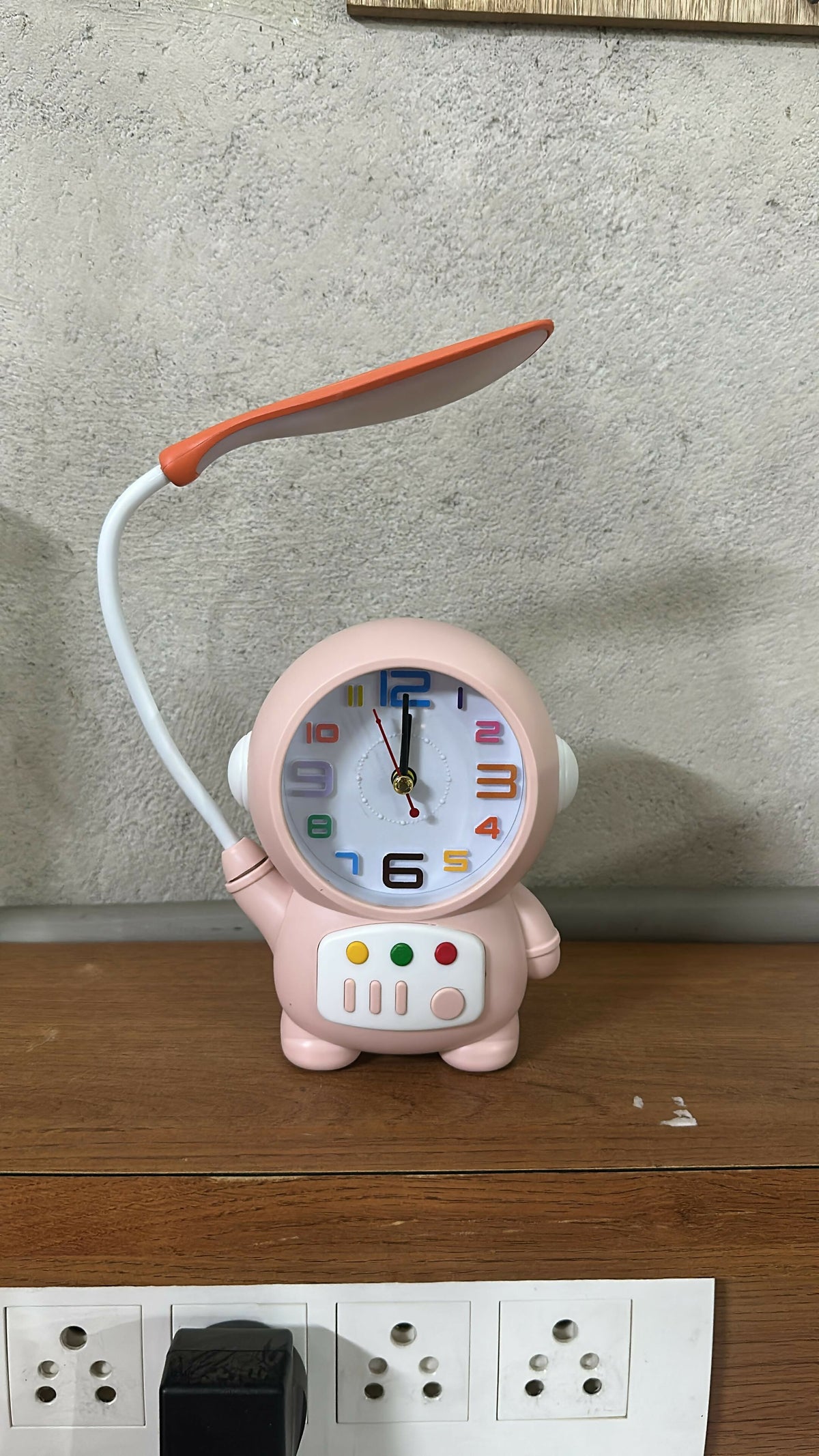 Child reading with Astronaut Table Lamp on their desk