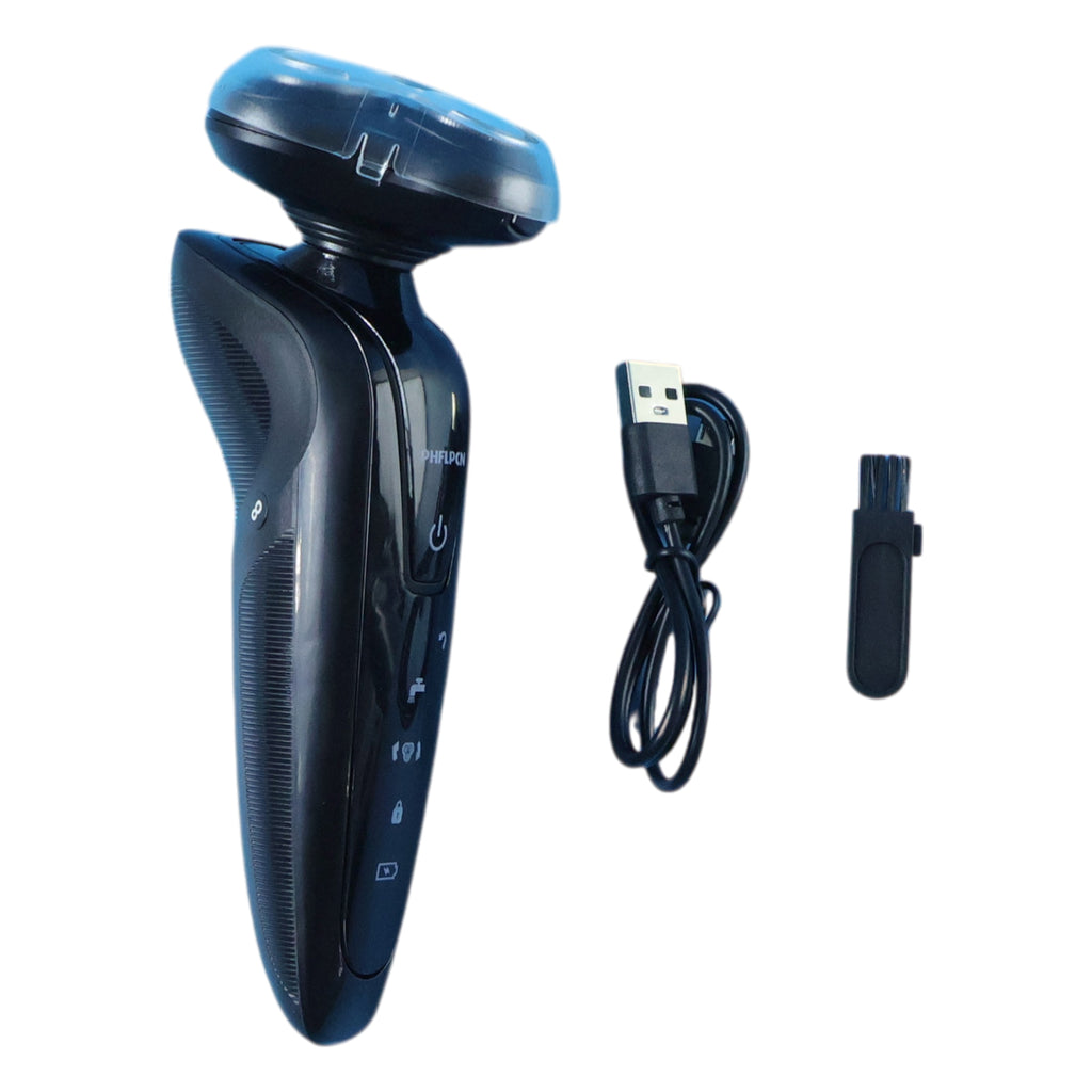 Electric rotary shaver connected to USB charging cable