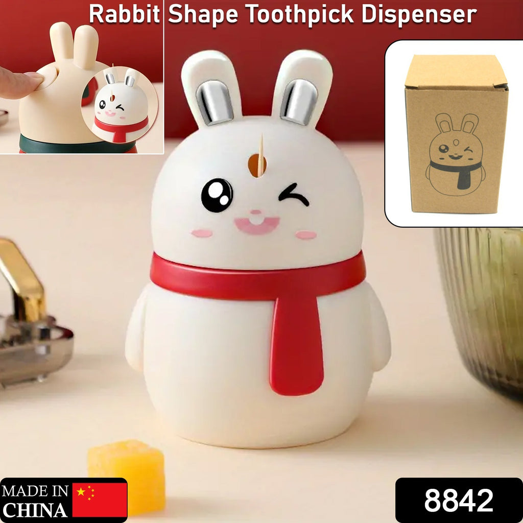 A red rabbit toothpick dispenser with a pressing mechanism shown on a clean surface.