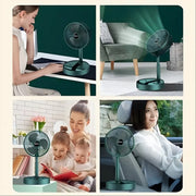 A dark green foldable desk fan, fully extended with a white power cord, stands upright against a plain white background.