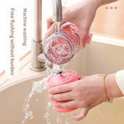 Compact 600ml portable juicer held by a hand, showing its size