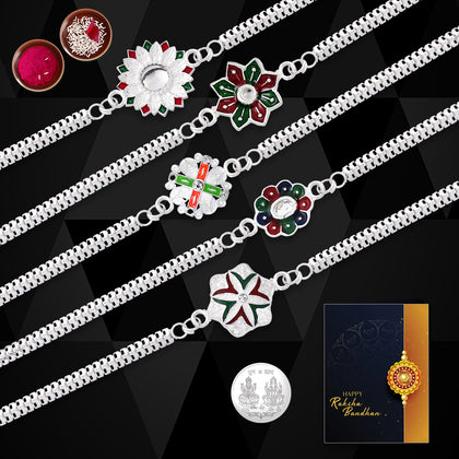 A beautiful Silver Rakhi Set with five stylish rakhis, a tilak kit, coin, and greeting card.
