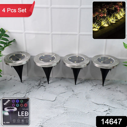 Set of 4 solar powered LED garden lights outdoors