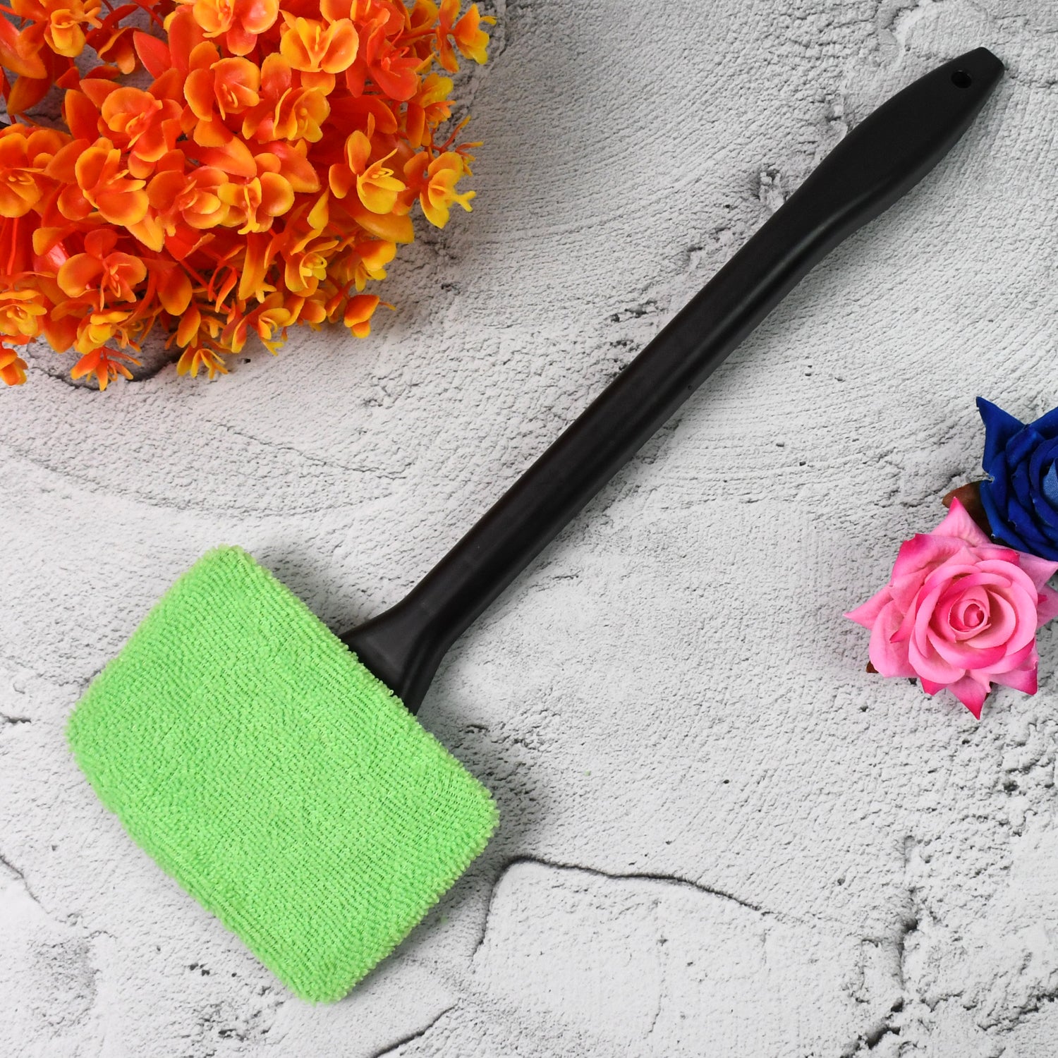 Side view of windshield glass cleaner wiper handle and cloth
