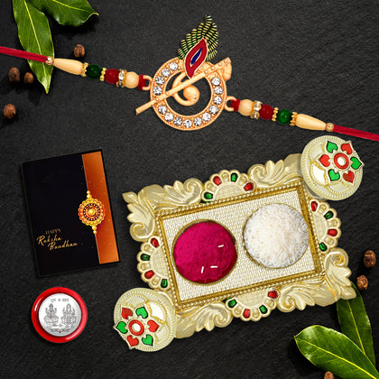 A beautifully arranged Rakhi Gift Set with Krishna Flute Rakhi and decorative Pooja Thali.