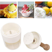 Manual ice shaver creating fine, fluffy shaved ice for a refreshing gola.