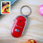 Portable whistle key finder on a table
