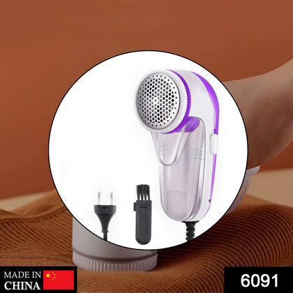 Creative Mind corded lint remover on a sweater