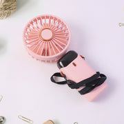 The rechargeable portable fan with an attached lanyard, demonstrating its easy carrying feature.