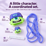 A green Mike Wazowski character charger cover, matching connector cover, blue spiral cable wrap, and white cable tie.