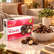A box of chocolates and a full bowl of them sit on a table in a cozy living room setting. – view 6