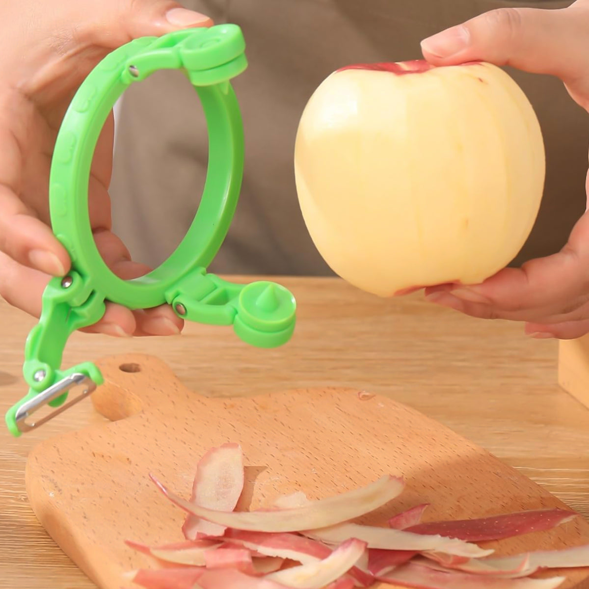 Multipurpose apple peeler shown with a variety of fruits and vegetables like apples, pears, and potatoes