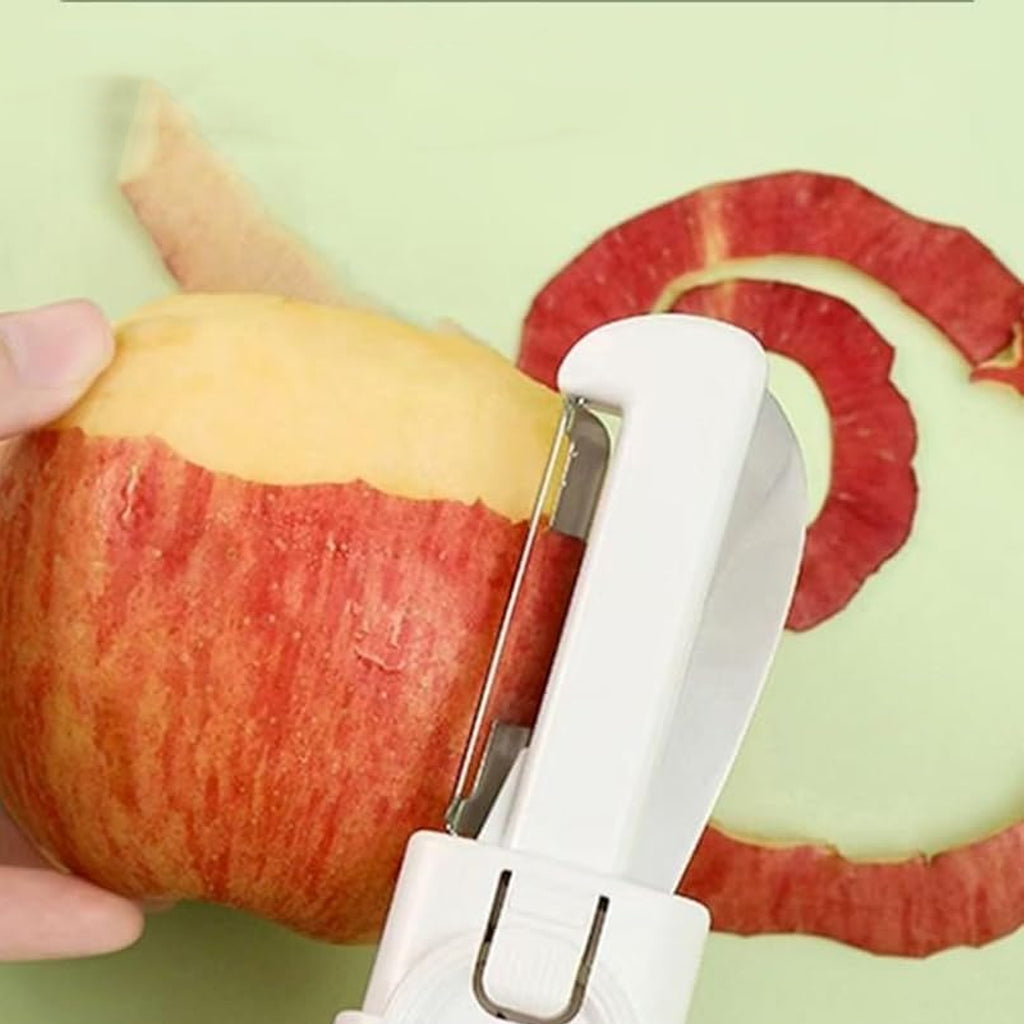 The Dual-use Knife Peeler being used to slice a fruit, demonstrating its versatile kitchen utility.