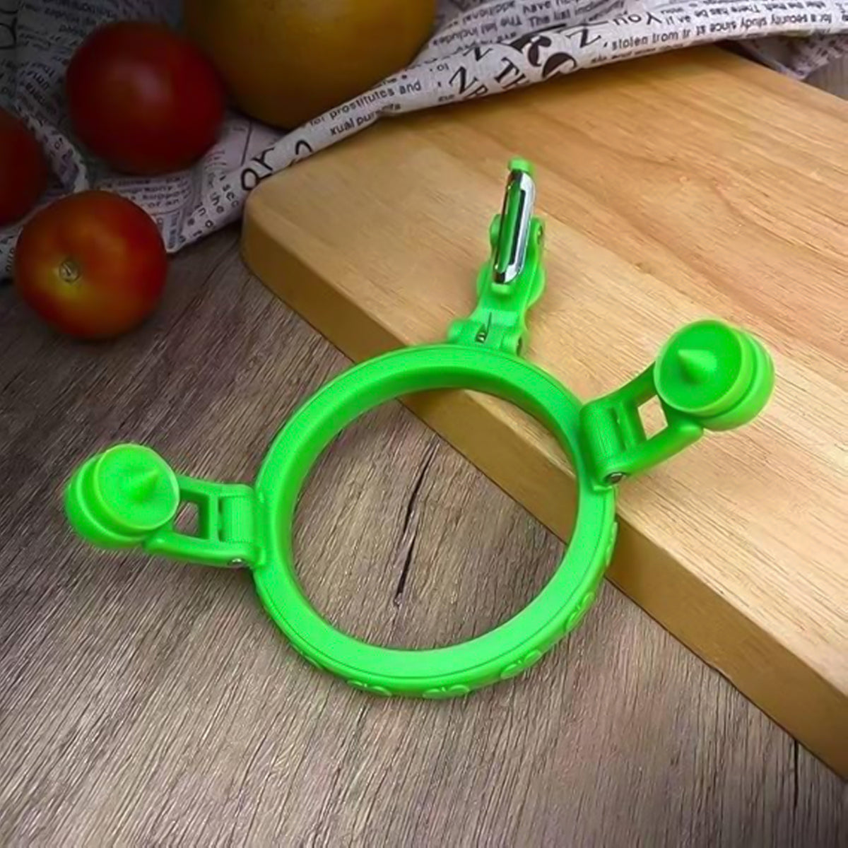 Adjustable apple peeler displayed next to a freshly peeled apple