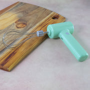 Cordless whisk showing ergonomic T-grip handle