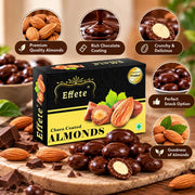 An overhead view of a black and yellow box of chocolate almonds surrounded by individual almonds and chocolate pieces.