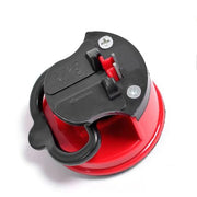 An angled view of the red and black sharpener highlights its black handle and two sharpening slots.