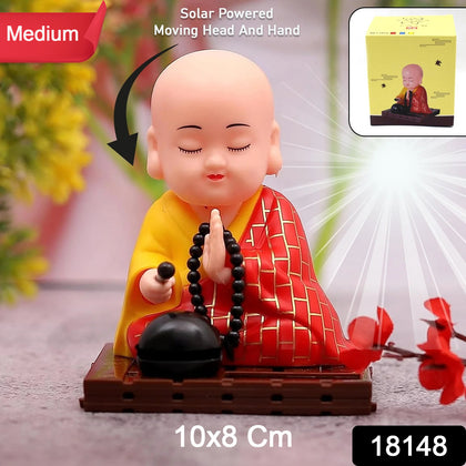 Solar powered Buddha statue with moving head and hand, front view