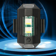 Black hexagonal strobe light with bright white LEDs on a blue glowing platform.