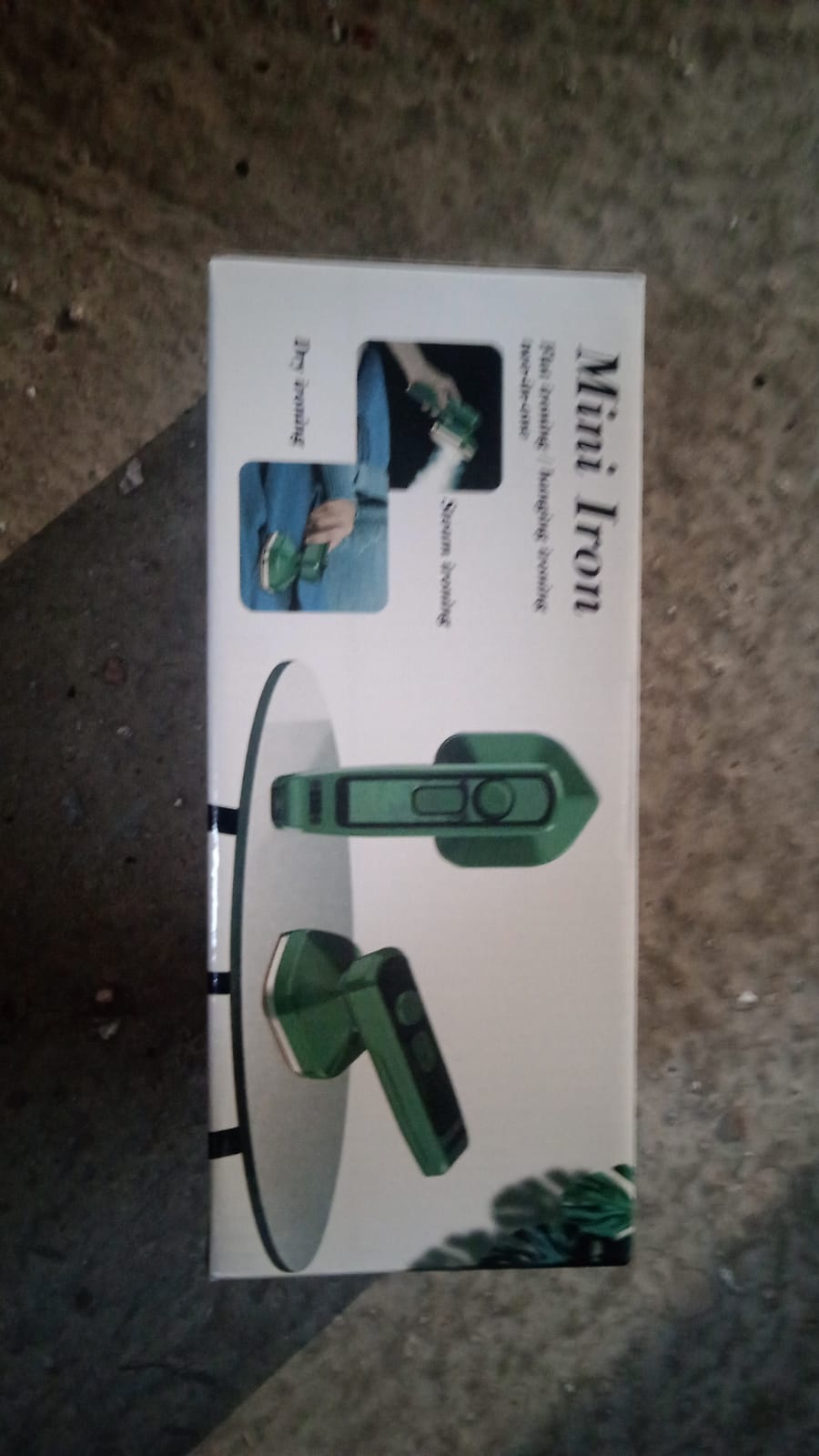 Mini steam iron vertical display on white background