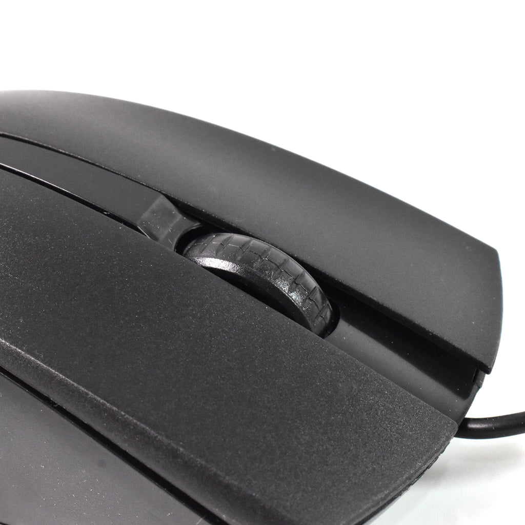 Wired Optical Mouse positioned next to a laptop, demonstrating its compact size and usability.