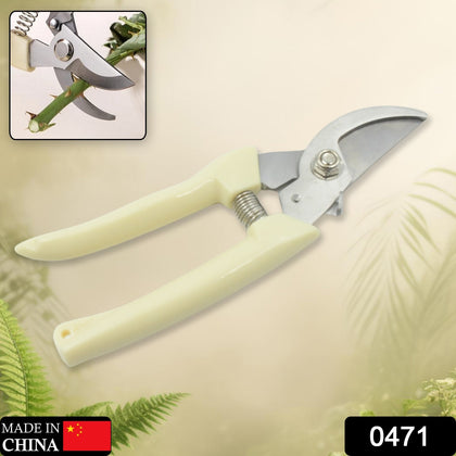 Person using stainless steel pruning shears to cut a branch