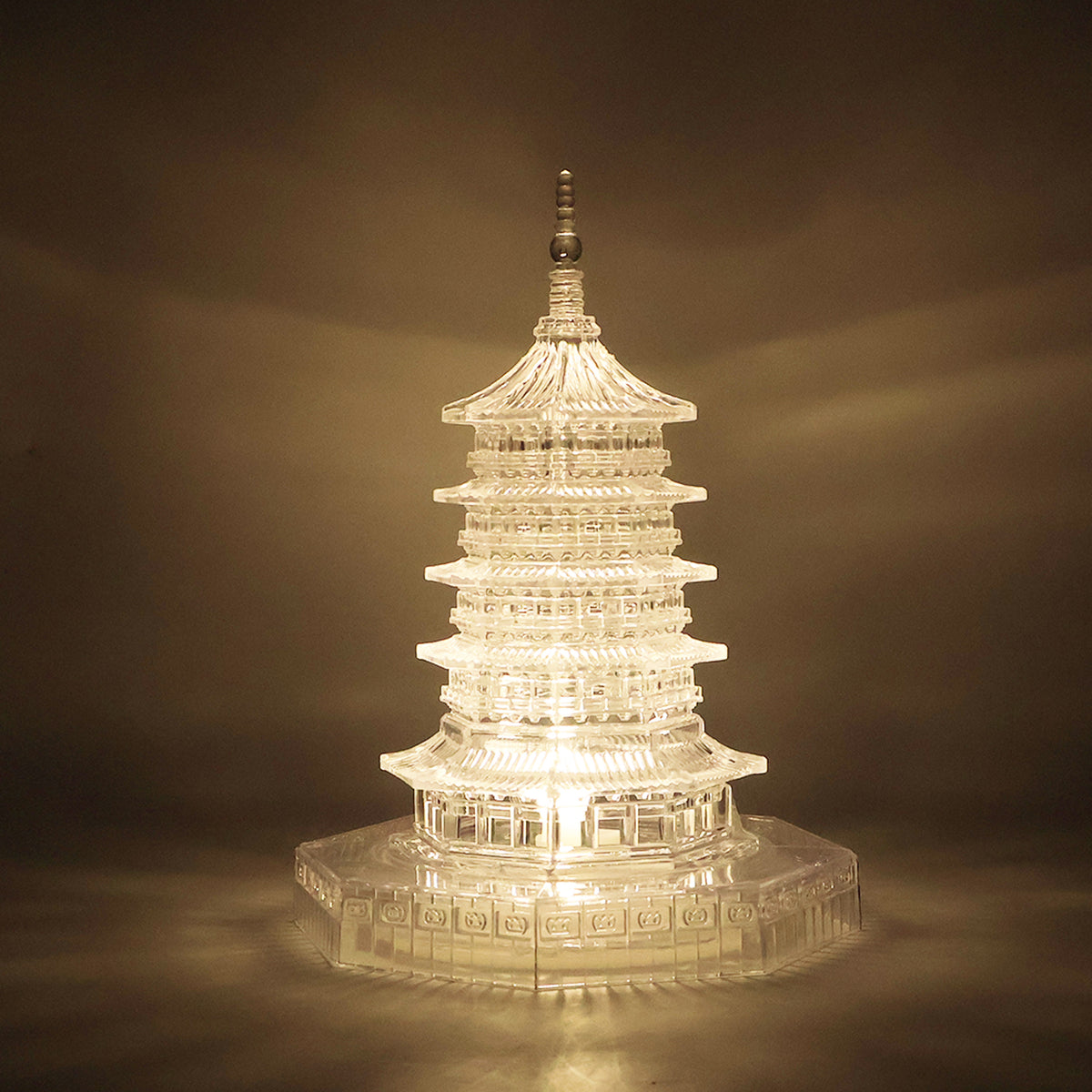 Hand holding the compact and portable LED crystal pagoda light