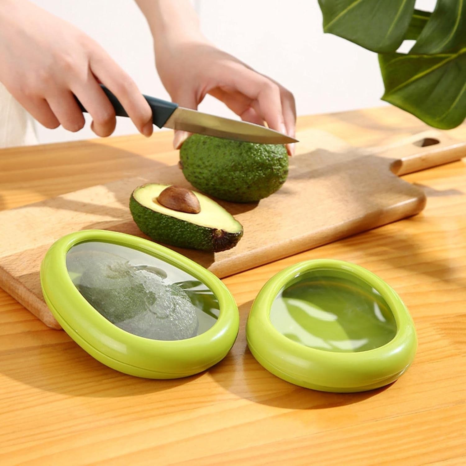 Green oval vegetable container holding fresh vegetables