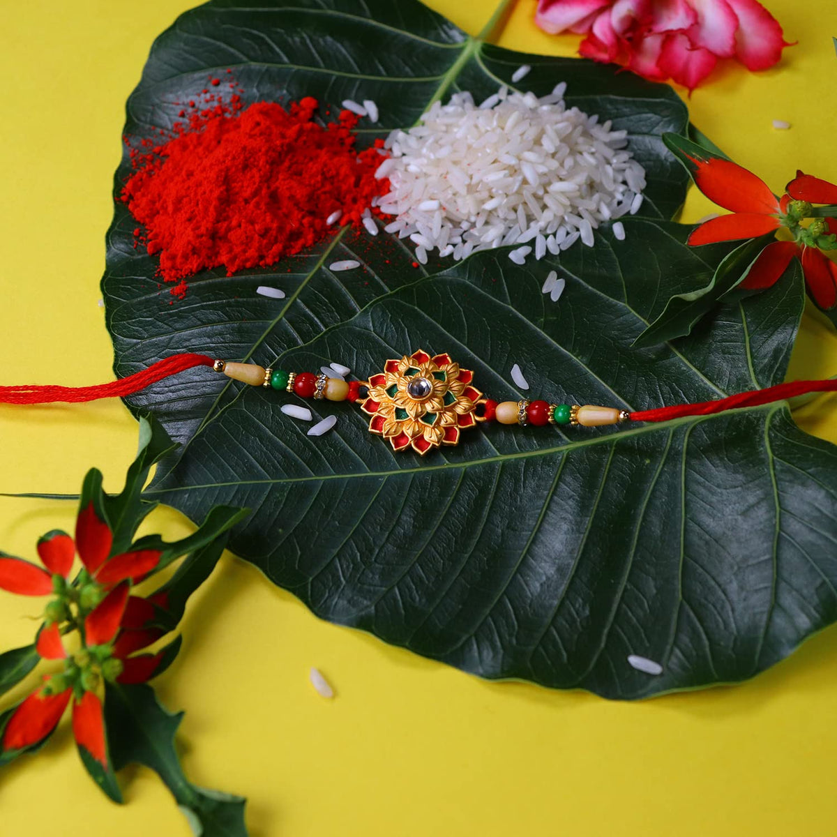 Traditional Tilak set for Rakhi rituals, including roli and chawal.