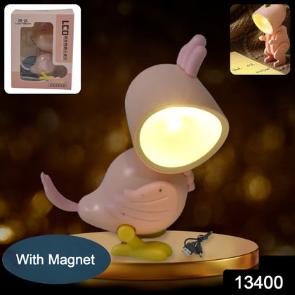 Magnetic parrot night lamp on a wooden surface with a book