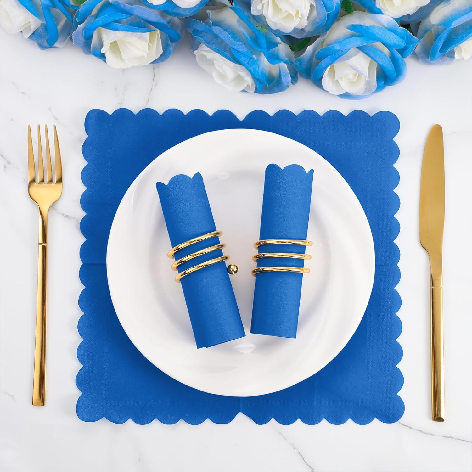 Royal blue scalloped napkin on a white plate with a dessert