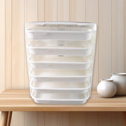 Person using 6 layer food organizer rack in kitchen