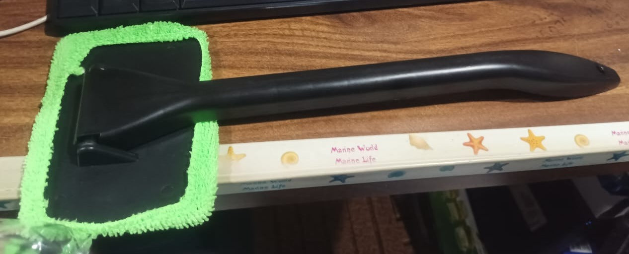 Windshield glass cleaner wiper laid flat showing handle and cloth