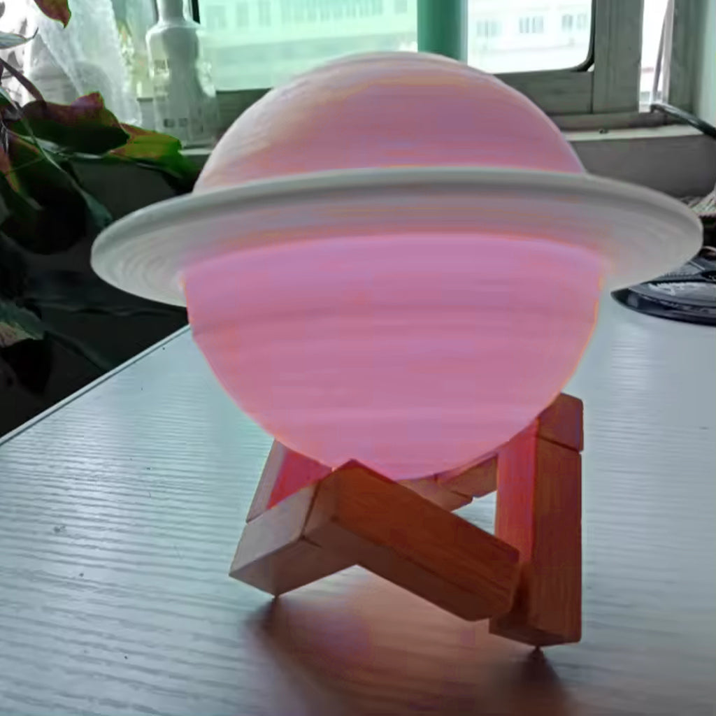 Hand holding the 3D Saturn Lamp showing its size
